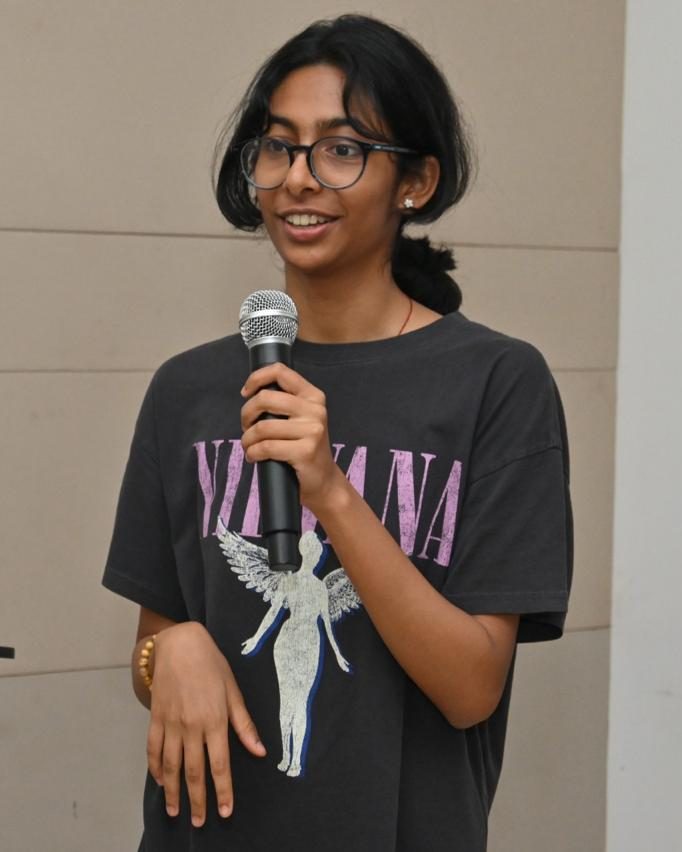 Shruti Arvind speaking to a group during a session